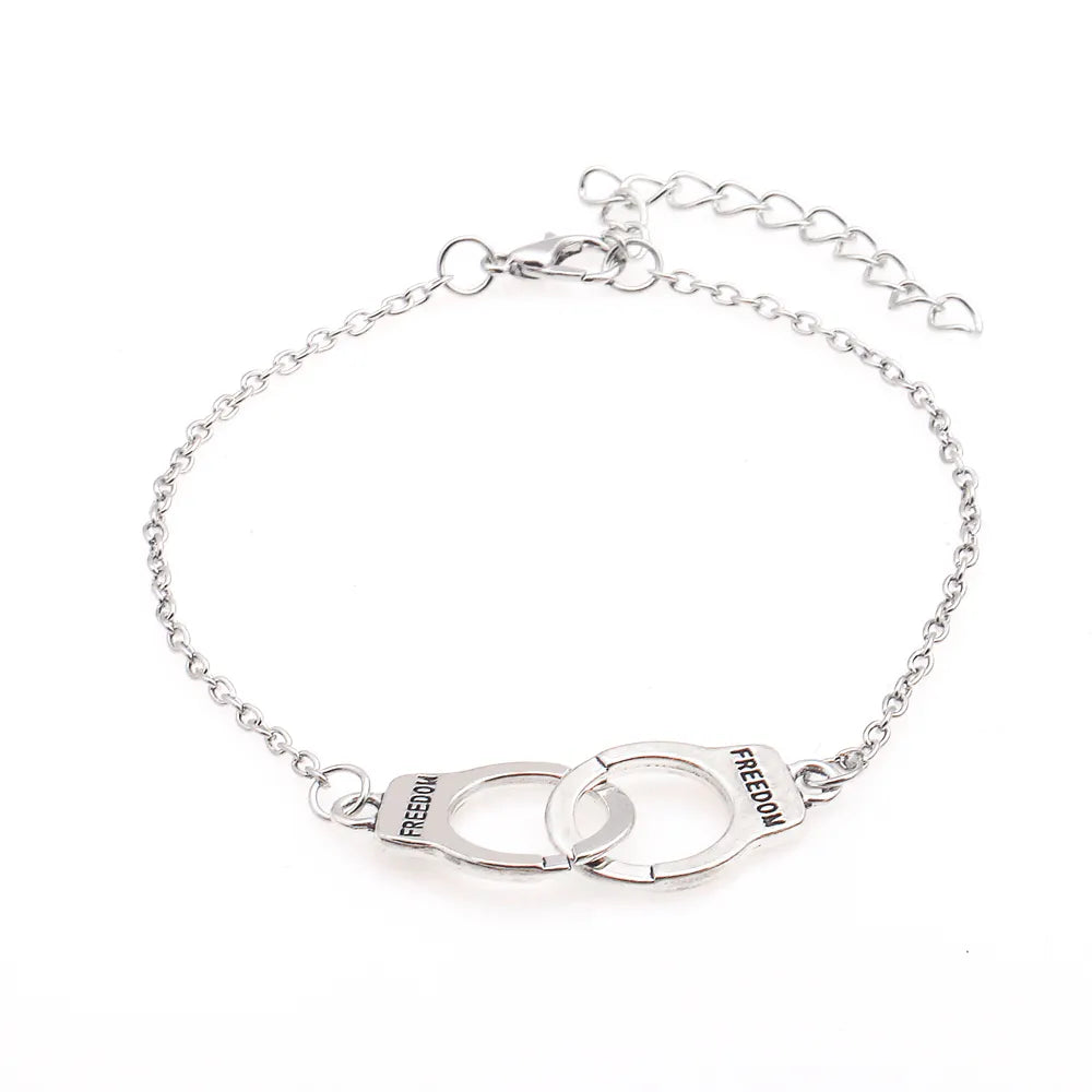 Bracelet menottes, bijou en acier inoxydable argenté