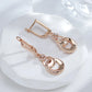Boucles d'oreilles pendantes anneaux enlacés, bijou en plaqué or rose et en zircons naturels
