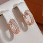Boucles d'oreilles anneaux incrustés de zircons, bijou en plaqué or rose et en zircons naturels