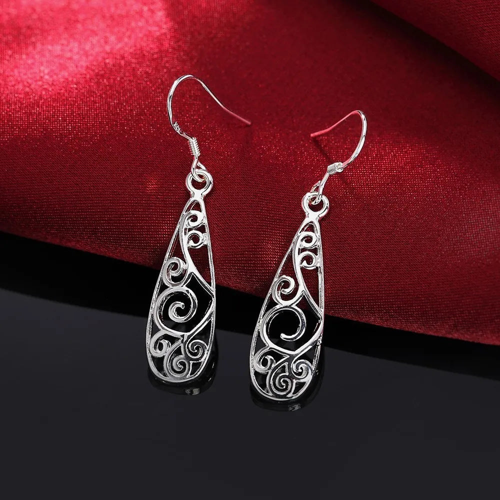 Boucles d'oreilles arabesques ajourées, bijou en plaqué argent