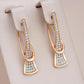 Boucles d'oreilles Pavés de zircons & courbes élégantes, bijou en plaqué or 585 (14 carats) et en zircons naturels