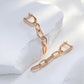 Boucles d'oreilles pendantes anneaux et zircons, bijou en plaqué or rose et en zircons naturels