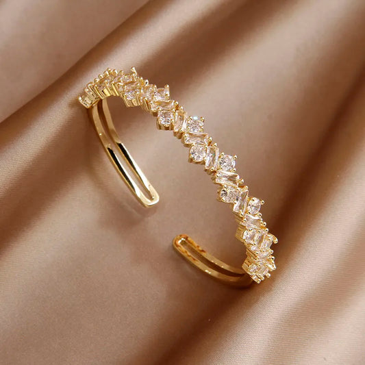 Bracelet Zircons géométriques, bijou en  alliage plaqué or 585 (14 carats) et en zircons naturels