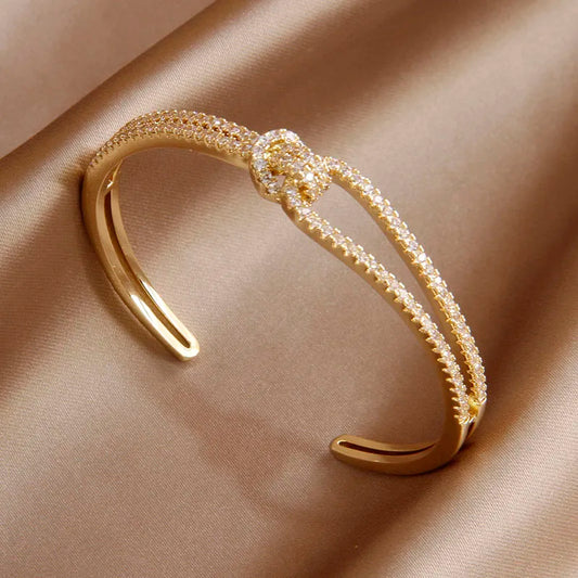 Bracelet Noeud, bijou en alliage plaqué or et en zircons naturels