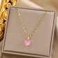 Collier coeur en zircons roses, maille Lips, bijou en plaqué or 585 et en cristal
