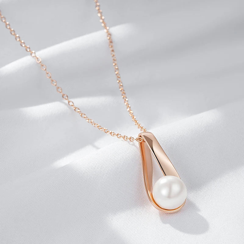 Collier pendentif perle nacrée, chaîne forçat, bijou en acrylique et en plaqué or rose