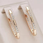 Boucles d'oreilles anneaux en V et zircons blancs, bijou en plaqué or rose et en zircons naturels