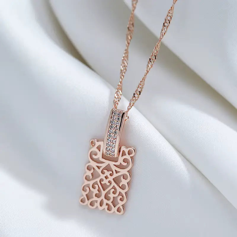 Collier avec motif d'arabesques et zircons, bijou en plaqué or rose 585 (14 carats) et en zircons naturels