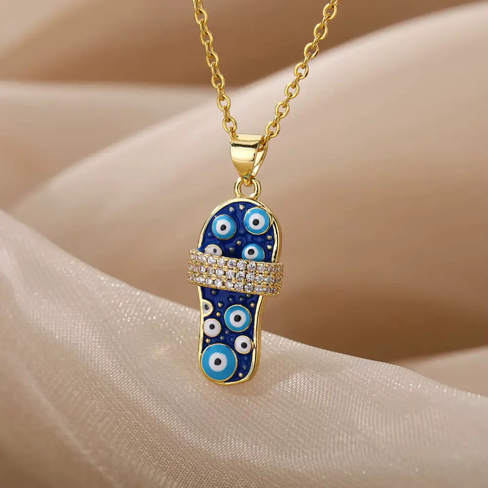 Collier sandale oeil turc, maille forçat, bijou en plaqué or, en émail et en zircons naturels