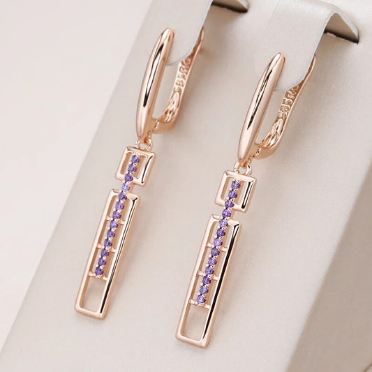 Boucles d'oreilles pendantes zircons mauves, bijou en plaqué or rose et en zircons naturels