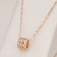 Collier pendentif exotique et ajouré, bijou en plaqué or rose et en zircons naturels